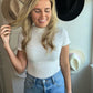 white ribbed bodysuit with mock neck