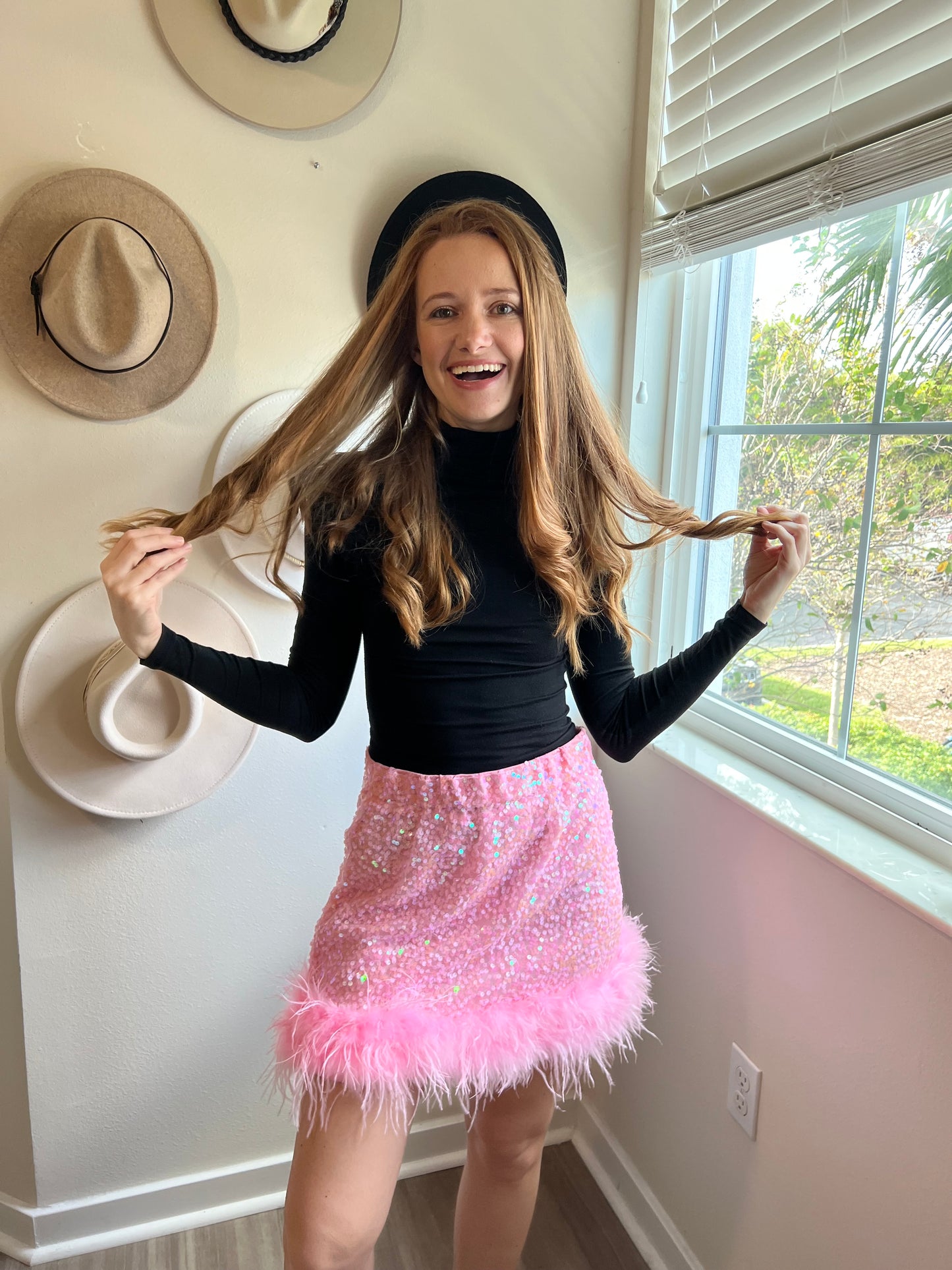 pink sequin mini skirt with feather hem