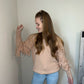 sweater with fringe detail on sleeves